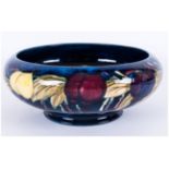 WITHDRAWN // Moorcroft 'Plum and Wisteria' Pattern Bowl, with inverted rim and low foot, a band of