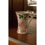 Mailing Lustre Finish Jug, decorated with raised flowers in pinks & greens. 12'' in height.