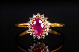 Ruby and White Topaz Ring, a 1.2ct oval cut ruby, of good colour, set in 14ct gold vermeil, with a