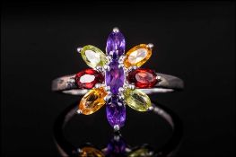 Multi Gemstone Flower Ring, the petals formed from marquise cut red garnets, amethysts, peridots and