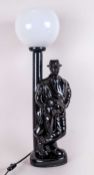 Modern Decorative Table Lamp, in a 1950's style of a gent leaning on lamp post. 18'', black with a