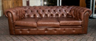 Brown Leather Three Seater Button Back Chesterfield Settee with three loose seat covers