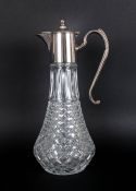 A Silver Plated Topped Cut Glass Claret Jug with flared design and star base. Excellent Condition.