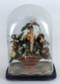 A Victorian Glass Globe With A Basket Of Wax Fruit Enclosed in the typical Victorian fashion of