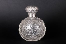 Edwardian Fine Silver Topped Cut Glass Globual Shaped Perfume Bottle complete with inner stopper.