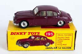 Dinky Toys No 195 Jaguar 3.4 Saloon Diecast Model. Maroon Body, Chrome Hubs. Red And Yellow