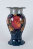 Moorcroft Tudric 'Pomegranate and Berries' Baluster Vase, classic colouring on a deep blue ground,