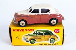 Dinky Toys No 159 Morris Oxford Saloon Diecast Model. With yellow picture card box,