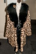 Ladies Ocelot Fur Coat, with fox fur collar,. Fully lined. slit pockets.