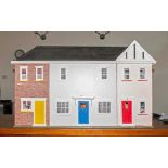 Large Dolls House made of wood and decorated throughout with a fitted bathroom, the other rooms