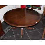 A Reproduction Mahogany Georgian Style Low Coffee Table supported by a pedestal base on four legs.