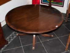 A Reproduction Mahogany Georgian Style Low Coffee Table supported by a pedestal base on four legs.