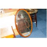 Oval Inlaid Mahogany Framed Edwardian Mirror with bevelled edge.