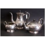 Three Piece EPNS Plated Tea Service, with engraving to the body. Melon Shaped with ebony handles.