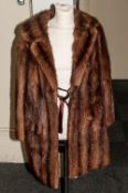 Ladies Dark Brown Mink Jacket, fully lined, collar with revers. flap pockets. slit tail.