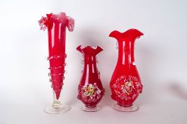 Three Red Glass Vases In The Murano Style, with Applied Flower Heads to the Body, One Fluted