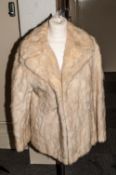 Musquash Ladies Brown Fur Coat, fully lined.