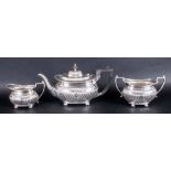 Edward VII Fine Silver Three Piece Tea Service Of Regency Form with half fluted decoration & pie-