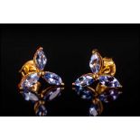 Tanzanite Marquise Cut Stud Earrings, each comprising three marquise cut tanzanites, the single