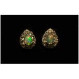 Opal and White Topaz Pair of Stud Earrings, each earring comprising a pear cut opal cabochon of .