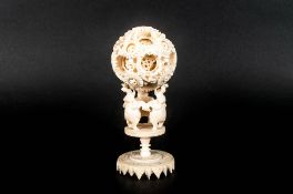 Chinese Ivory Late 19th Century Carved Puzzle Ball and Stand. Elaborately Carved Puzzle Ball, with