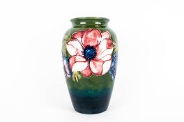 W. Moorcroft Signed Tubelined Vase ' Anemone ' Design, Mixed Colours on a Blue / Green Ground. c.