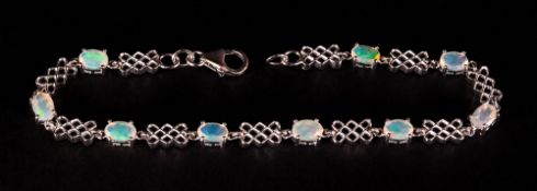 Opal Trellis Pattern Bracelet, nine oval cut, faceted opals, with good displays of colour,