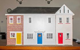 Large Dolls House made of wood and decorated throughout with a fitted bathroom, the other rooms
