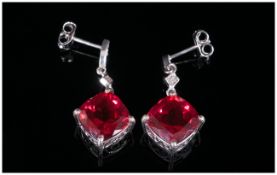 Ruby Colour Quartz and Diamond Drop Earrings, 8.75cts of the ruby red quartz in two cushion cuts,