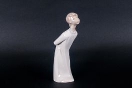 Lladro Boy Blowing Figure number 4869. 8'' in height