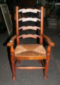 Small 19thC Ladder Back Child's Chair with angular arms, step ball feet and rush seat. c 1880. 30