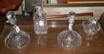 Three Glass Decanters comprising 2 captain & one with square base. All with star cut bases &