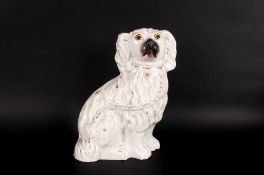 Staffordshire Pottery Spaniel Figure 9 inches high. 19thC. With white and gold leaf decoration,