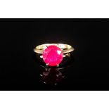 Ruby Solitaire Ring, 5.5cts of round cut ruby in a 9ct gold, six prong setting, allowing the