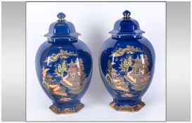 A G Harley Jones Pair of Large Chinoiserie Cover Vases, the hexagonal, bulbous bodies decorated with