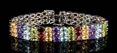 Amethyst, Red Garnet, Peridot Multi-Gemstone Bracelet, comprising three rows of of oval cuts in