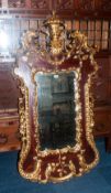 Large French Style Shaped Mirror, Gilt Painted Acanthus And Scroll Carved Decoration. 62 x 33