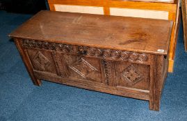 Antique Oak Coffer with a Lift up Lid, To The Front Carved with a Geometric Floral Design In Three