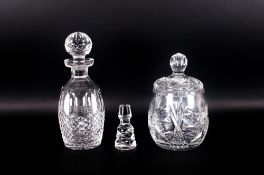 Cut Glass Decanter, with star cut base and stopper. Together with a glass biscuit barrel. With one