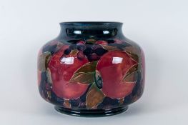 William Moorcroft Tube lined Bulbous Shaped Vase, Decorated with Pomegranates and Leaves Pattern