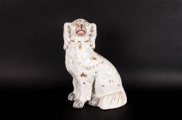 Staffordshire Pottery Spaniel Figure 9 inches high. 19thC. With white and gold leaf decoration,