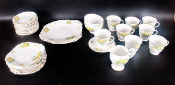 Bell China Part Tea Set 'Primrose' Pattern comprising 8 cups, 12 saucers, 8 side plates, 2 cake