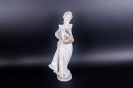 Lladro Style Figurine ' Young Woman with Basket of Flowers ' Stands 13 Inches High. Mint Condition.