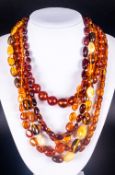 Collection of Amber Necklaces, a good selection comprising four ovoid, round and freeform