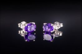 Pair of Amethyst Stud Earrings, oval cut rich purple amethysts, 1ct in each, set in silver with post