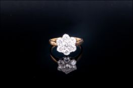 18ct Yellow Gold Set Daisy Seven Stone Diamond Cluster Ring the diamonds of good colour & clarity.