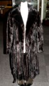 Dark Brown Full Length Mink Coat, fully lined. Half back belt. Slit pockets. Collar with revers.