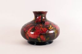 William Moorcroft Signed Flambe Tubelined Onion Shaped Vase, early 'Orchids' pattern. Chocolate