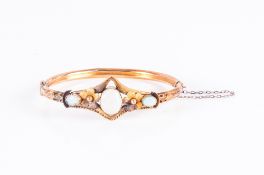 Edwardian 9ct Gold Hinged Bangle, The Front Set With 3 Milk Opals Displaying Flashes Of Reds And