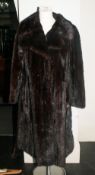 Ladies Dark Brown Mink Coat, fully lined, collar with revers. Plus spare loose pelts.